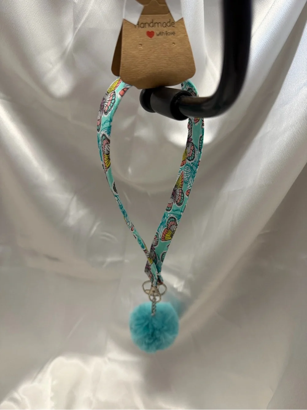 Handmade Rainbow Butterfly Pattern Wristlet Keychain with Bright Blue Pompom